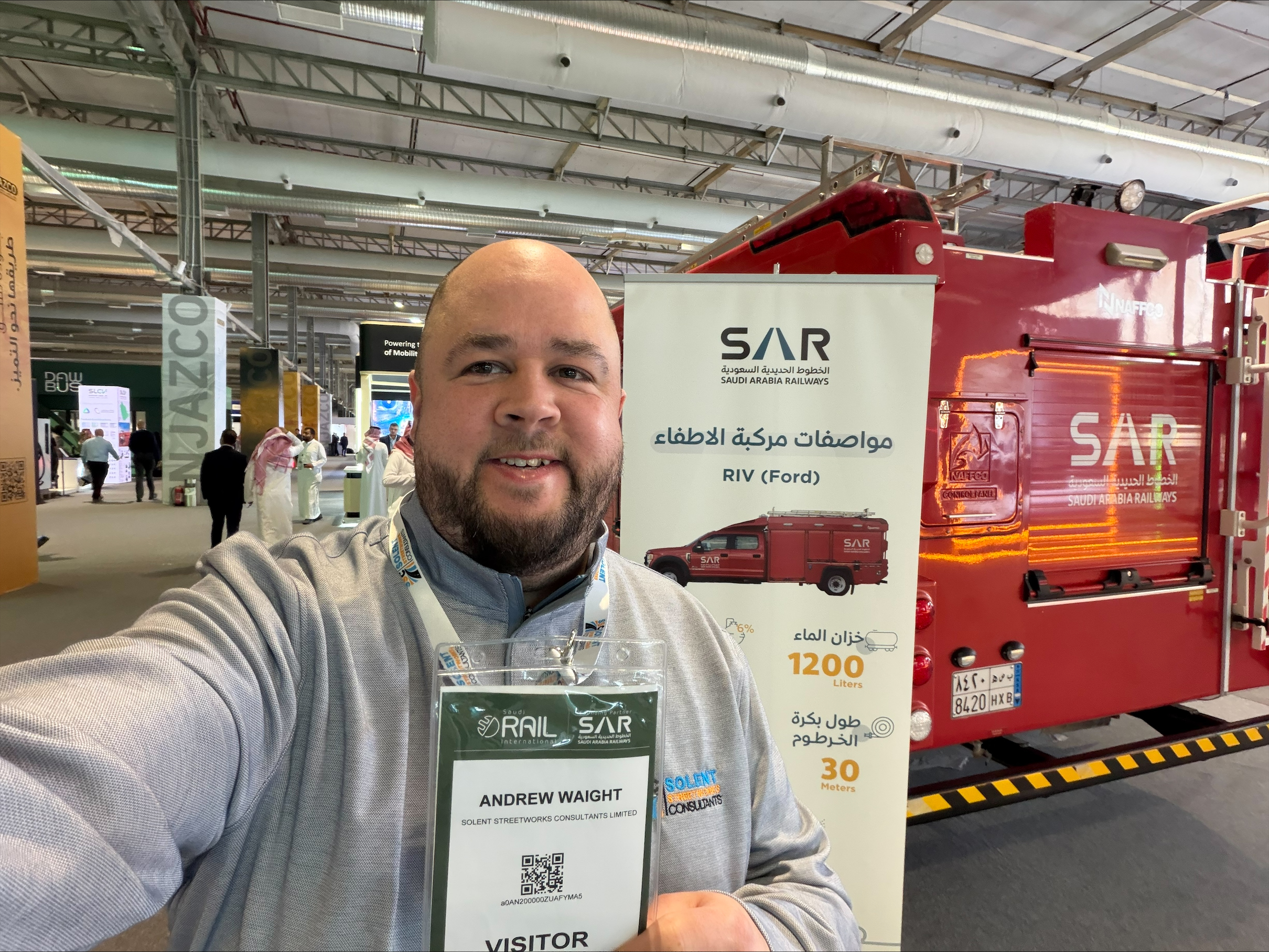 Andrew in Riyadh with red Saudi Arabia Rail display